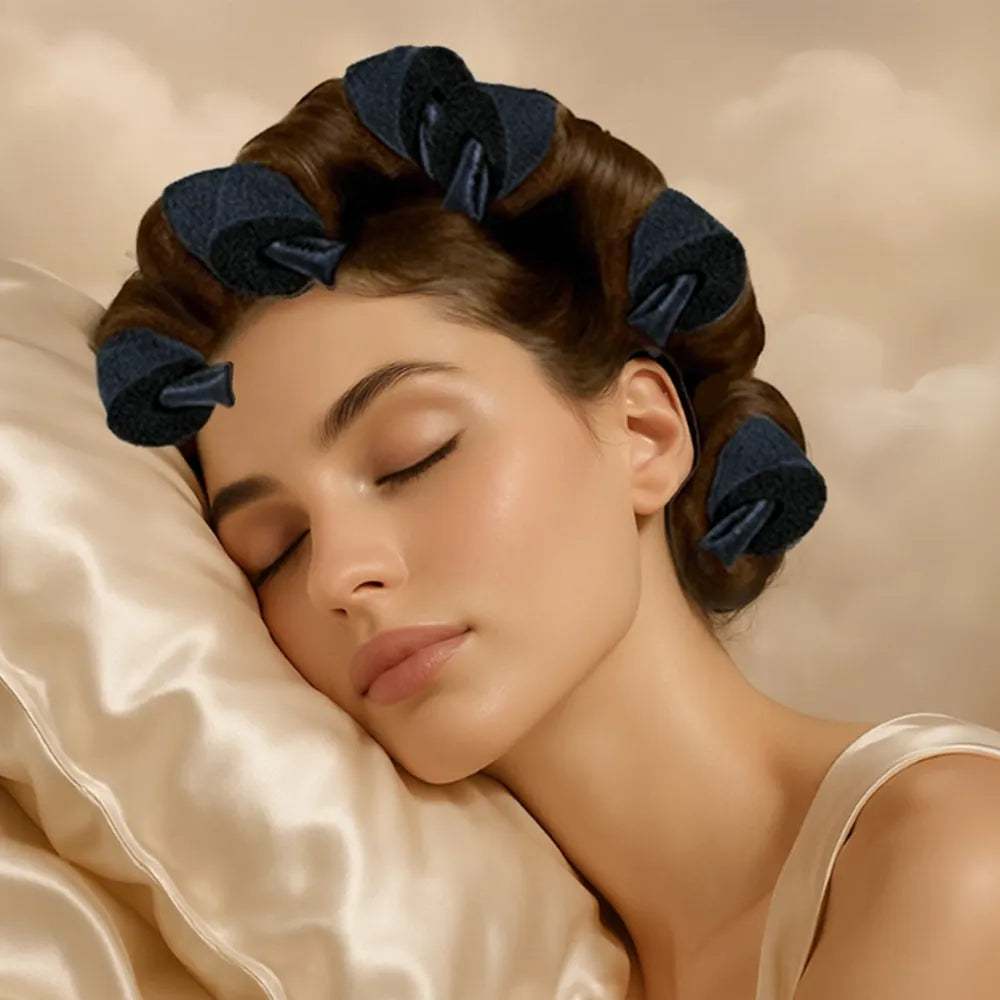 Woman sleeping with hair in rollers on a soft pillow